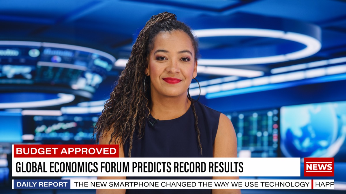TV Live News Program: Female Presenter Reporting. Television Cable Channel Black Anchorwoman Talks. Mock-up Network Broadcasting Concept in Newsroom Studio. Medium Shot